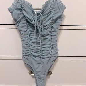 NWT baby blue lace up body suit